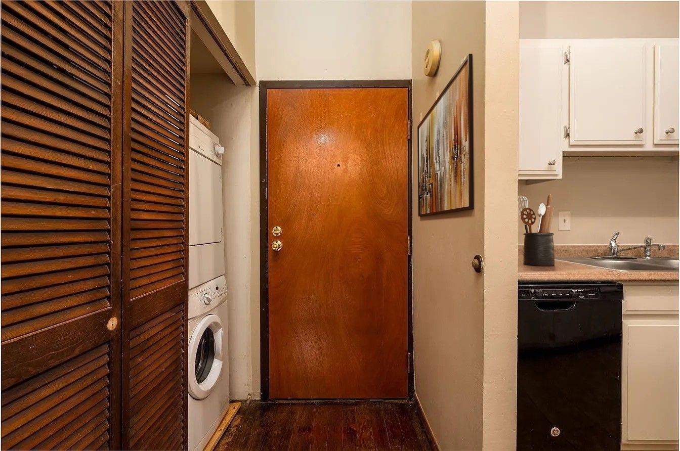 107 South Front Street, Unit 41 Memphis, TN 38103 - Photo 5 of 17 a kitchen with a refrigerator and a sink