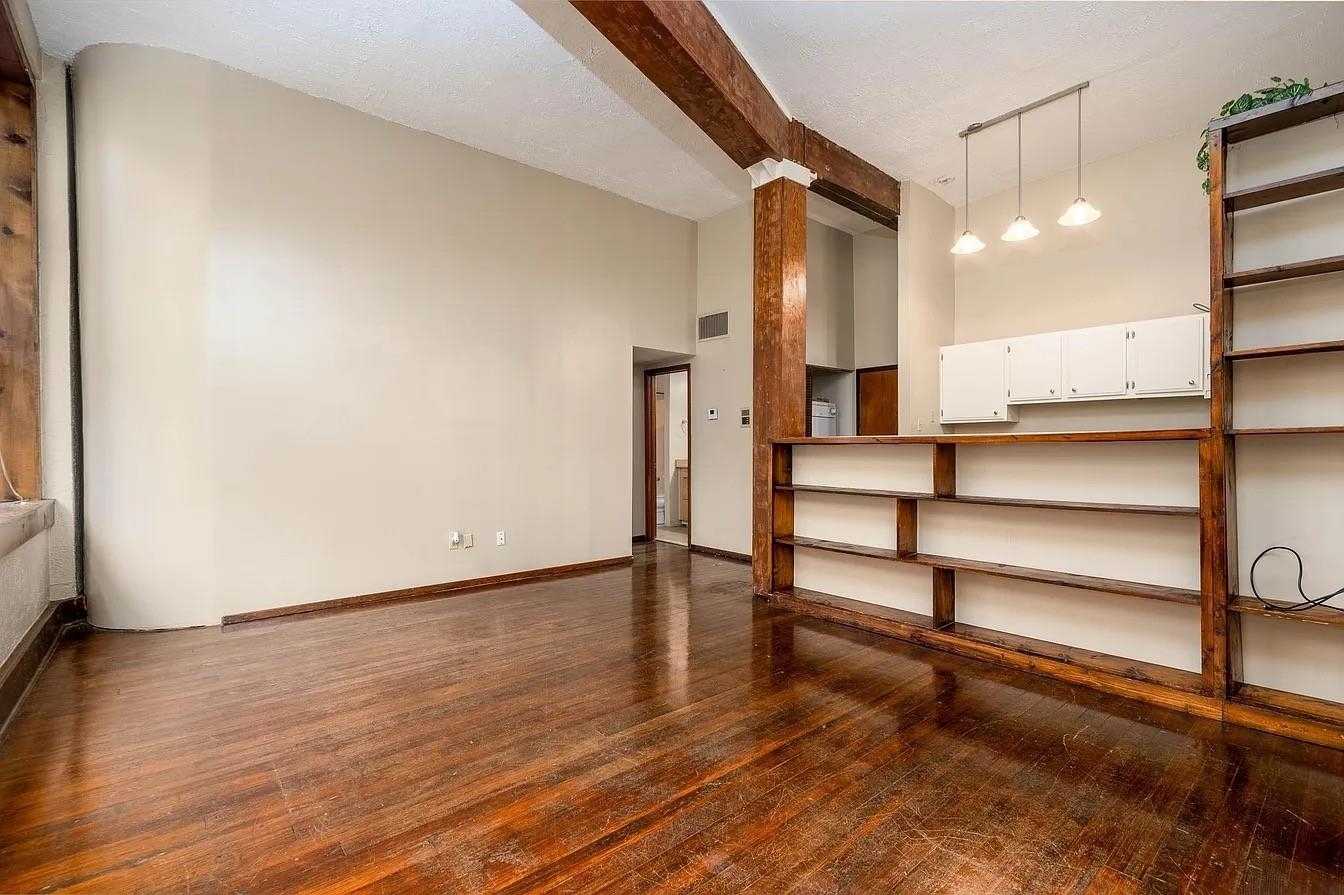 107 South Front Street, Unit 41 Memphis, TN 38103 - Photo 7 of 17 a view of entryway and hall with wooden floor
