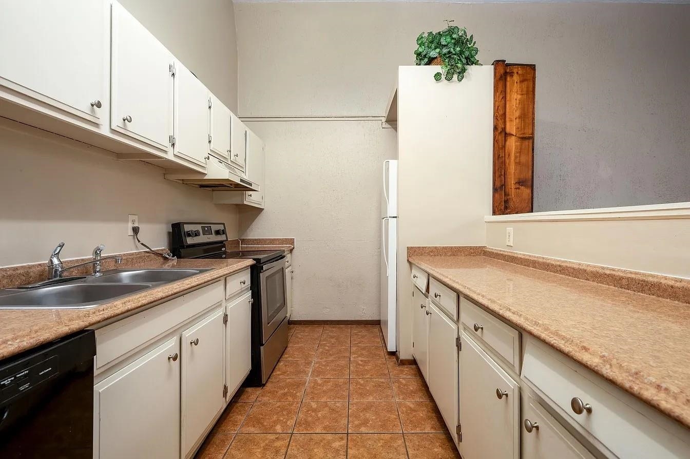 107 South Front Street, Unit 41 Memphis, TN 38103 - Photo 9 of 17 a kitchen with a sink and cabinets
