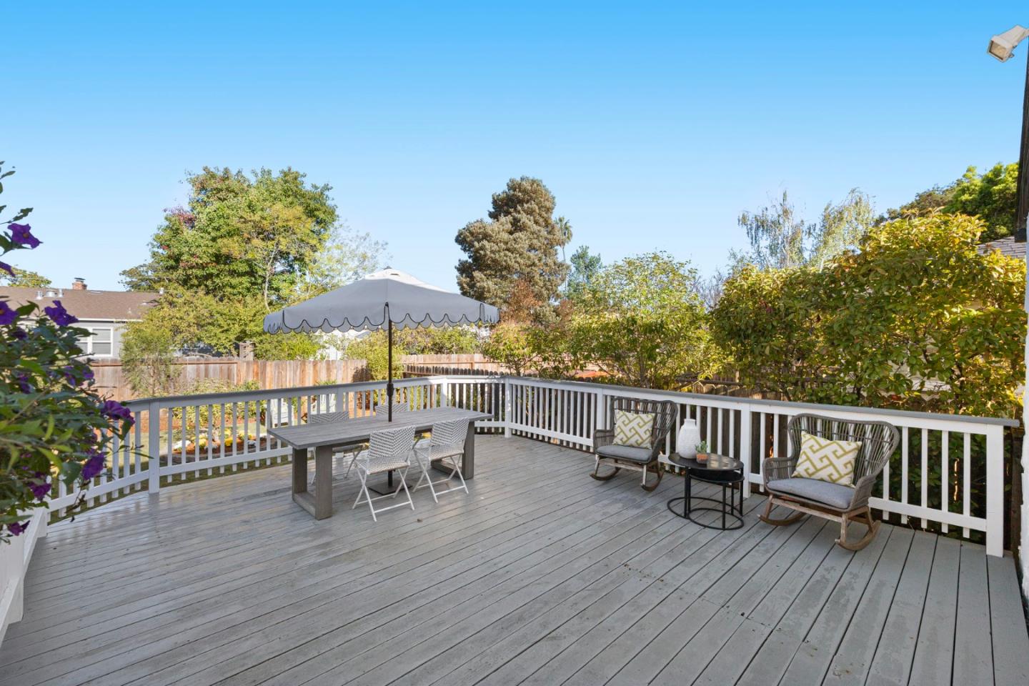 1030 Morrell Avenue Burlingame, CA 94010 - Photo 27 of 37 a view of a roof deck with table and chairs and wooden floor