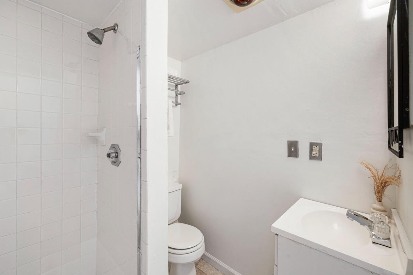 1030 Morrell Avenue Burlingame, CA 94010 - Photo 35 of 37 a white toilet sitting next to a bathroom sink