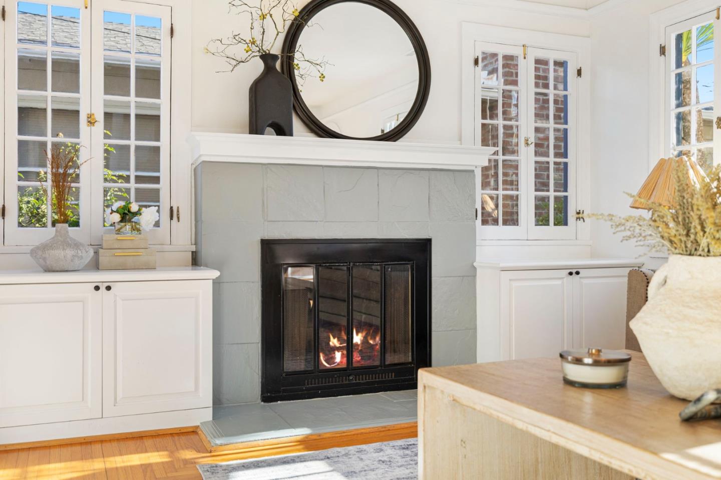 1030 Morrell Avenue Burlingame, CA 94010 - Photo 9 of 37 a living room with a fireplace and a window