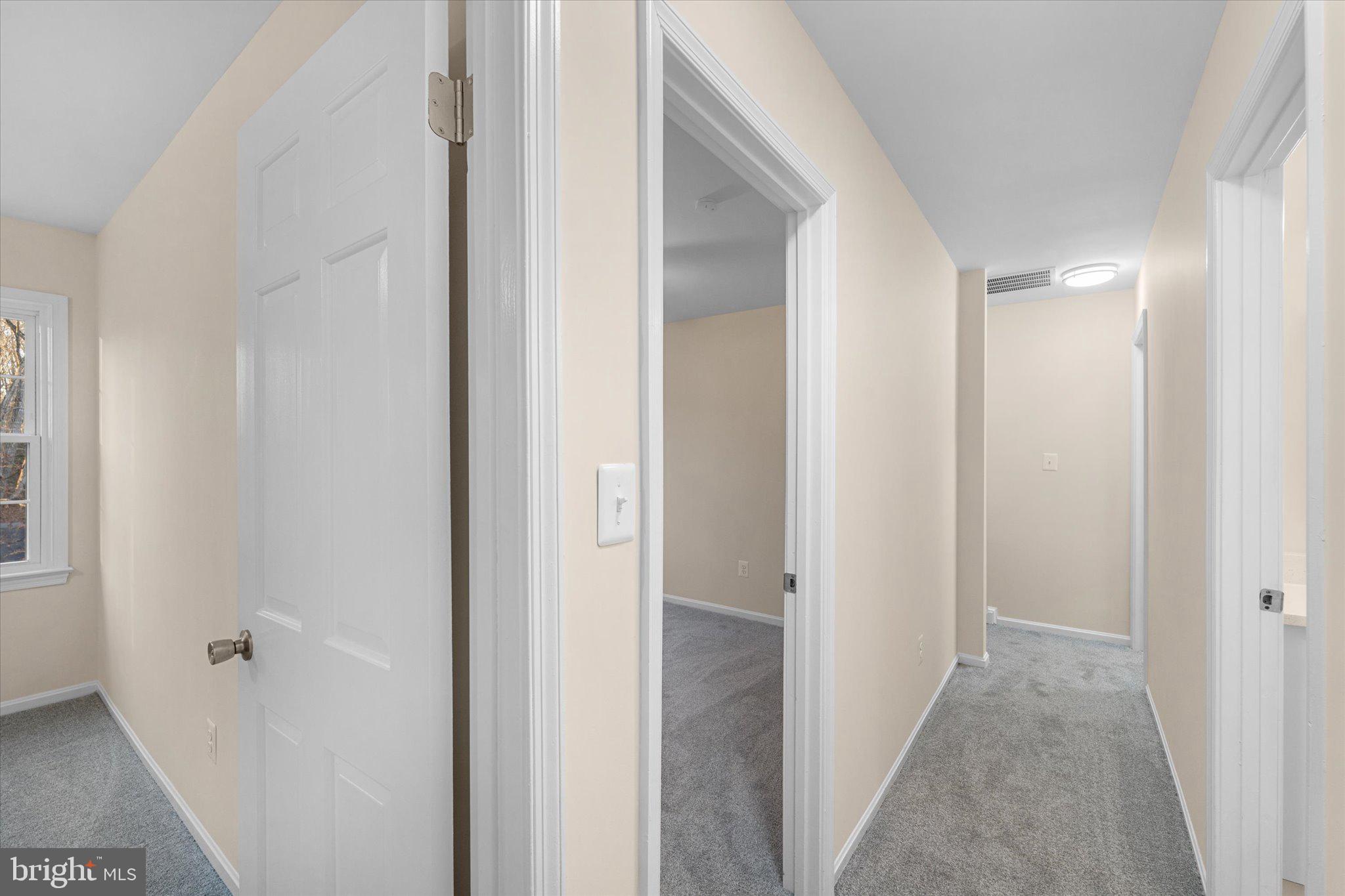 8016 Stillbrooke Road Manassas, VA 20112 - Photo 19 of 41 a view of a hallway with closet and door
