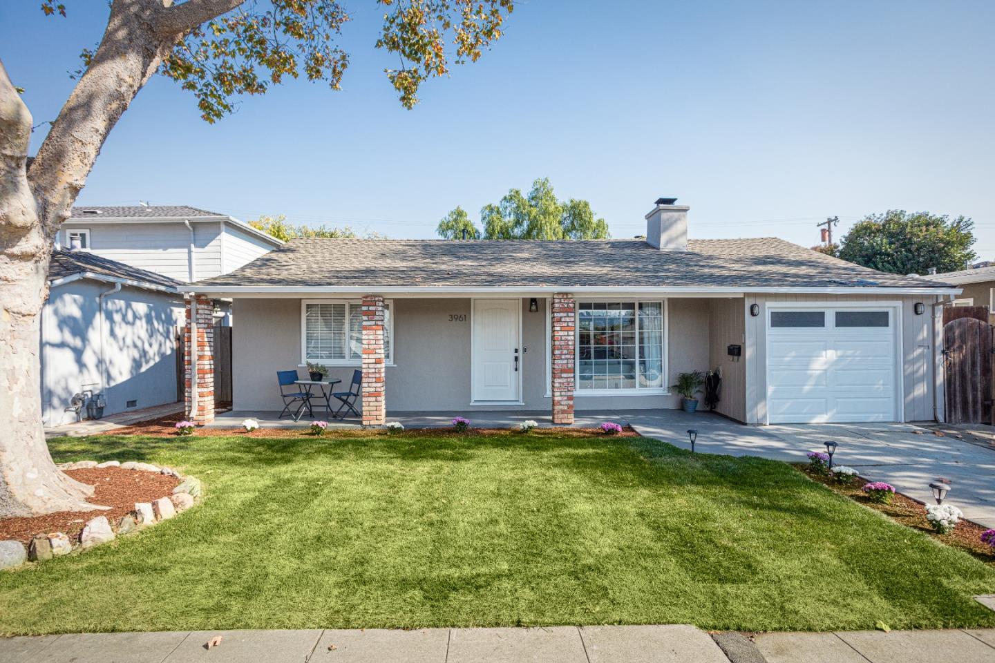 front view of a house with a yard