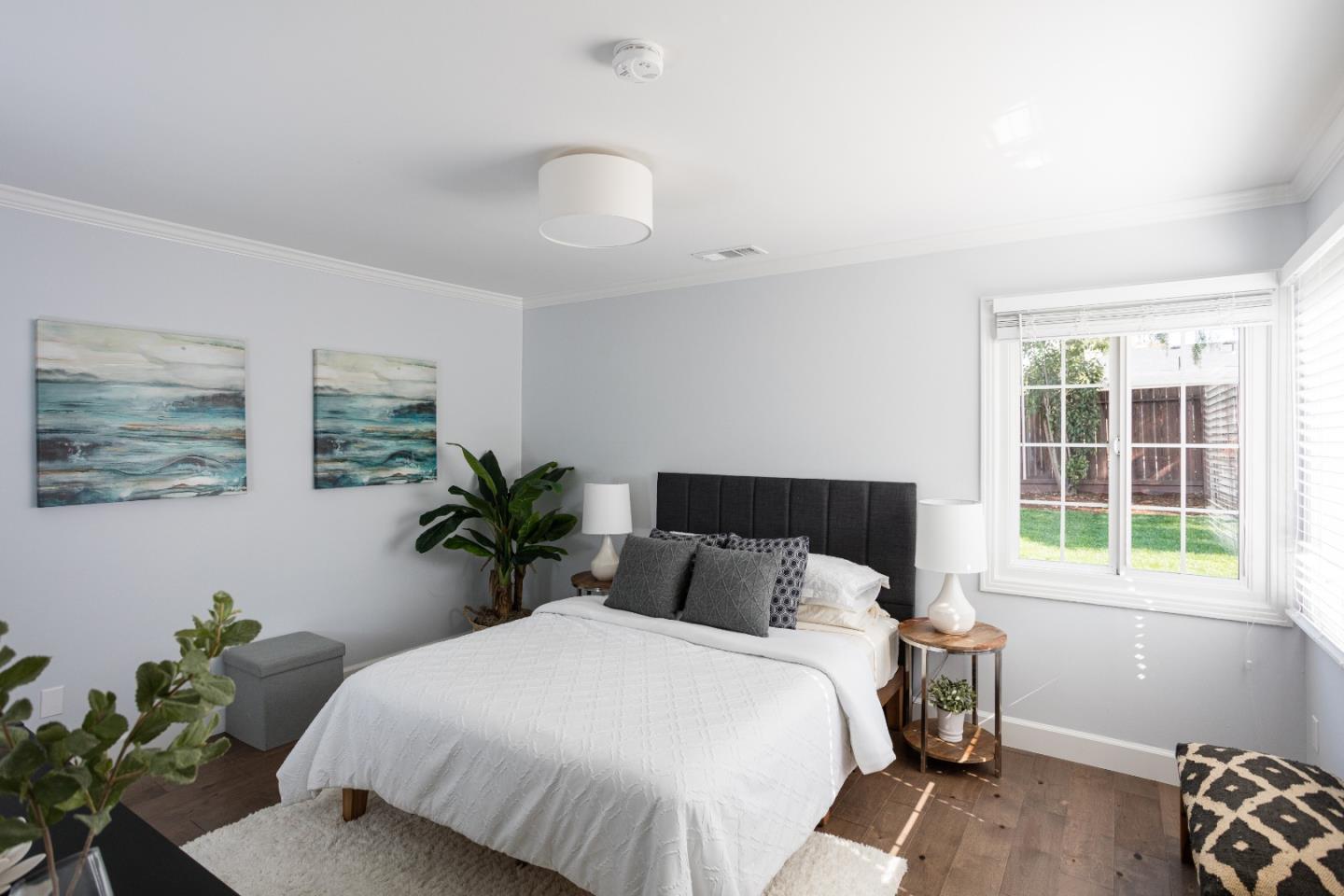 3961 Casanova Drive San Mateo, CA 94403 - Photo 12 of 14 a bed sitting in a bedroom next to a window