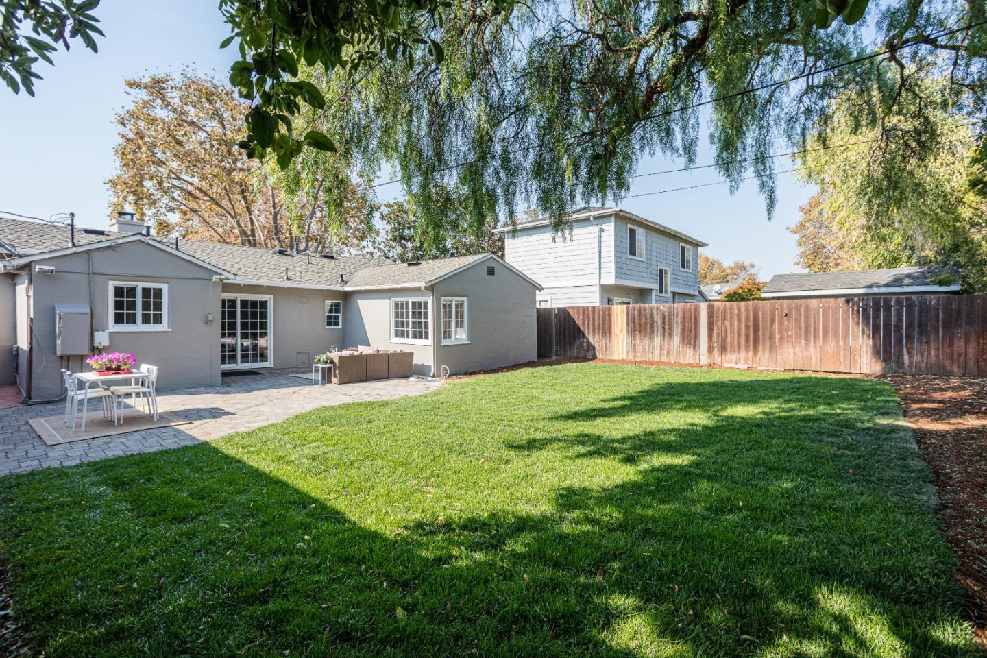 3961 Casanova Drive San Mateo, CA 94403 - Photo 14 of 14 a view of a house with a yard and sitting area