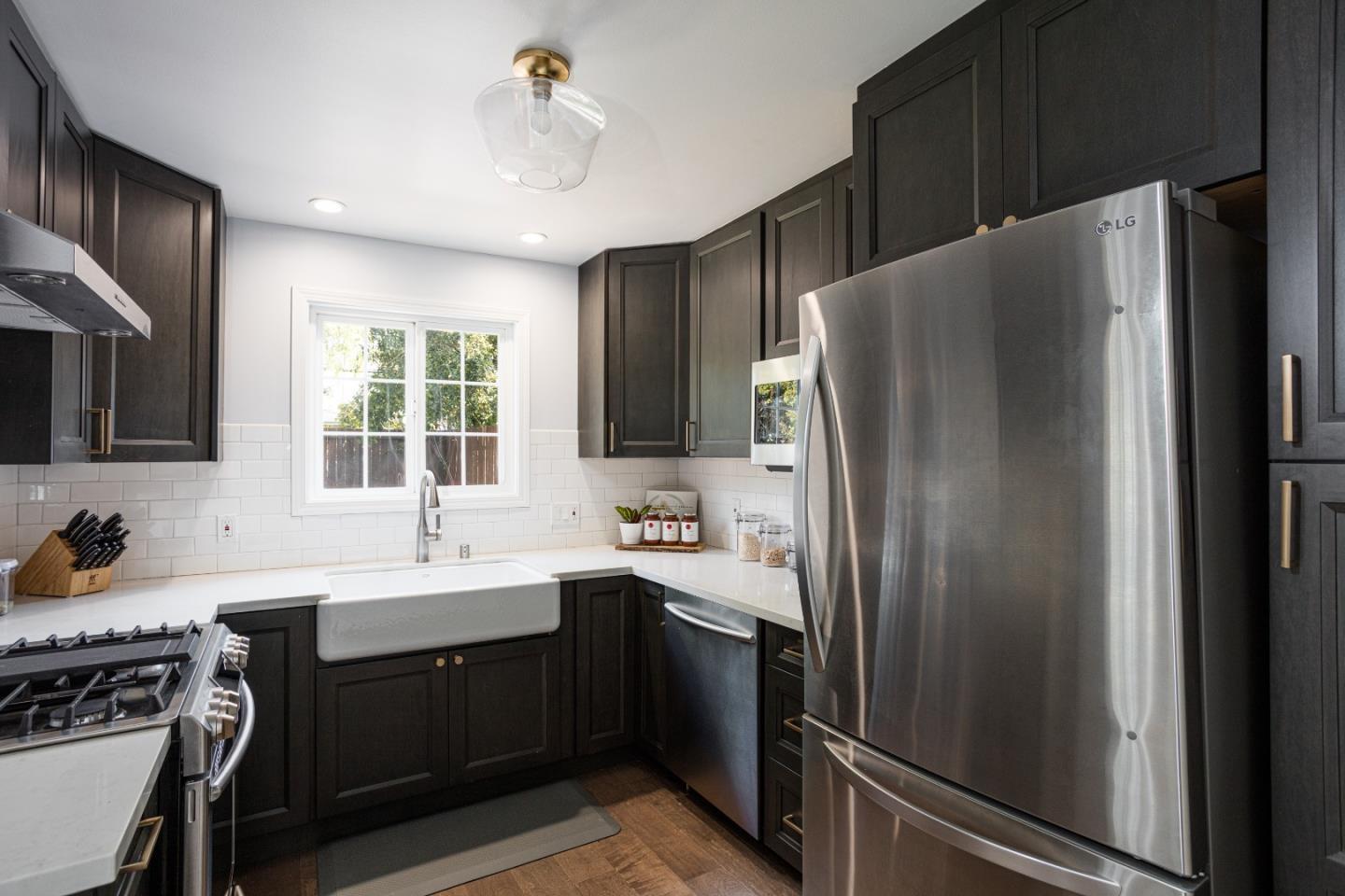 3961 Casanova Drive San Mateo, CA 94403 - Photo 6 of 14 a kitchen with stainless steel appliances a refrigerator sink and cabinets