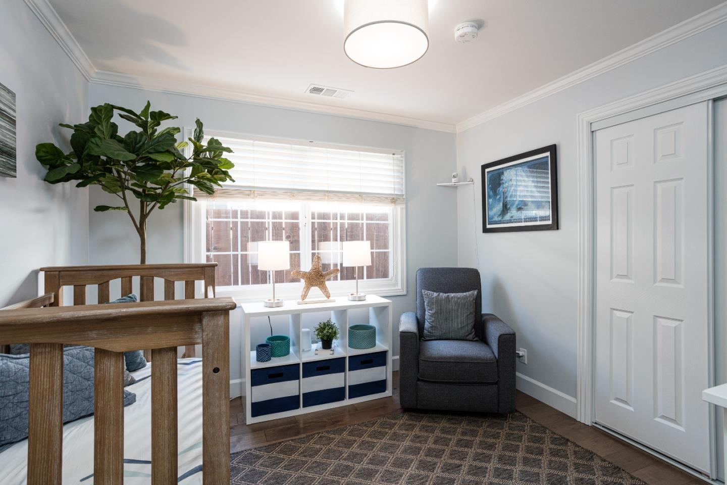 3961 Casanova Drive San Mateo, CA 94403 - Photo 9 of 14 a living room with furniture and a potted plant