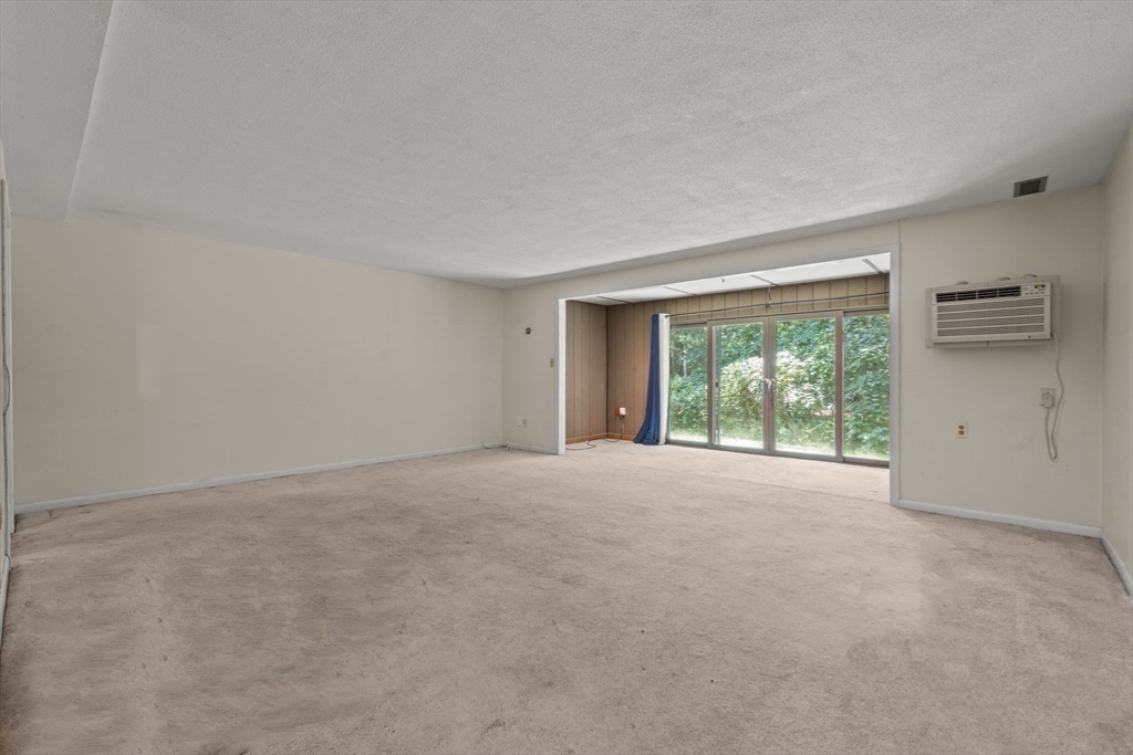 374 Great Road, Unit 11 Acton, MA 01720 - Photo 17 of 30 a view of a room that has a window in it