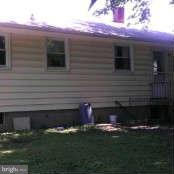 6811 Lenbern Road Baltimore, MD 21207 - Photo 14 of 14 a front view of a house with a yard