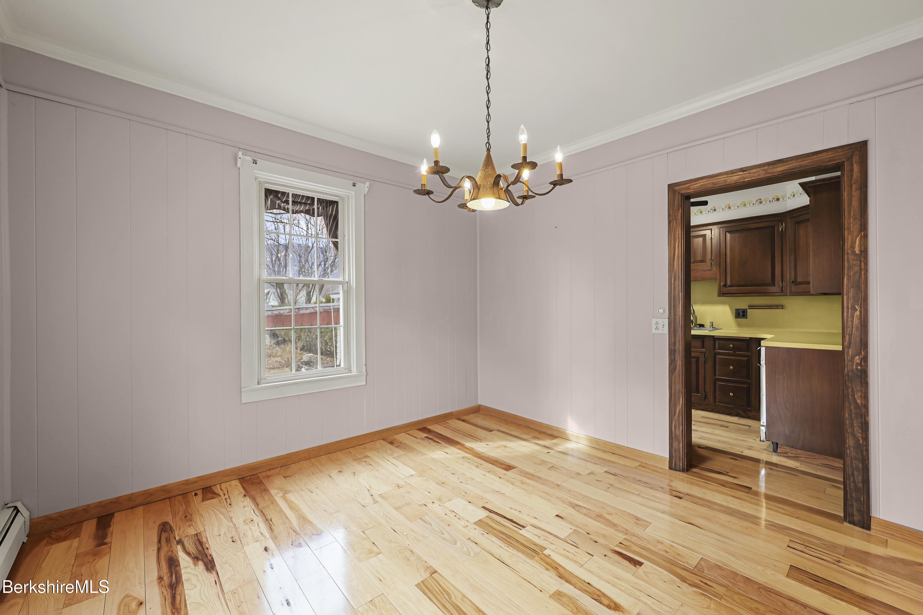 Undisclosed Address Adams, MA 01220 - Photo 11 of 33 a bedroom with a bed and a chandelier