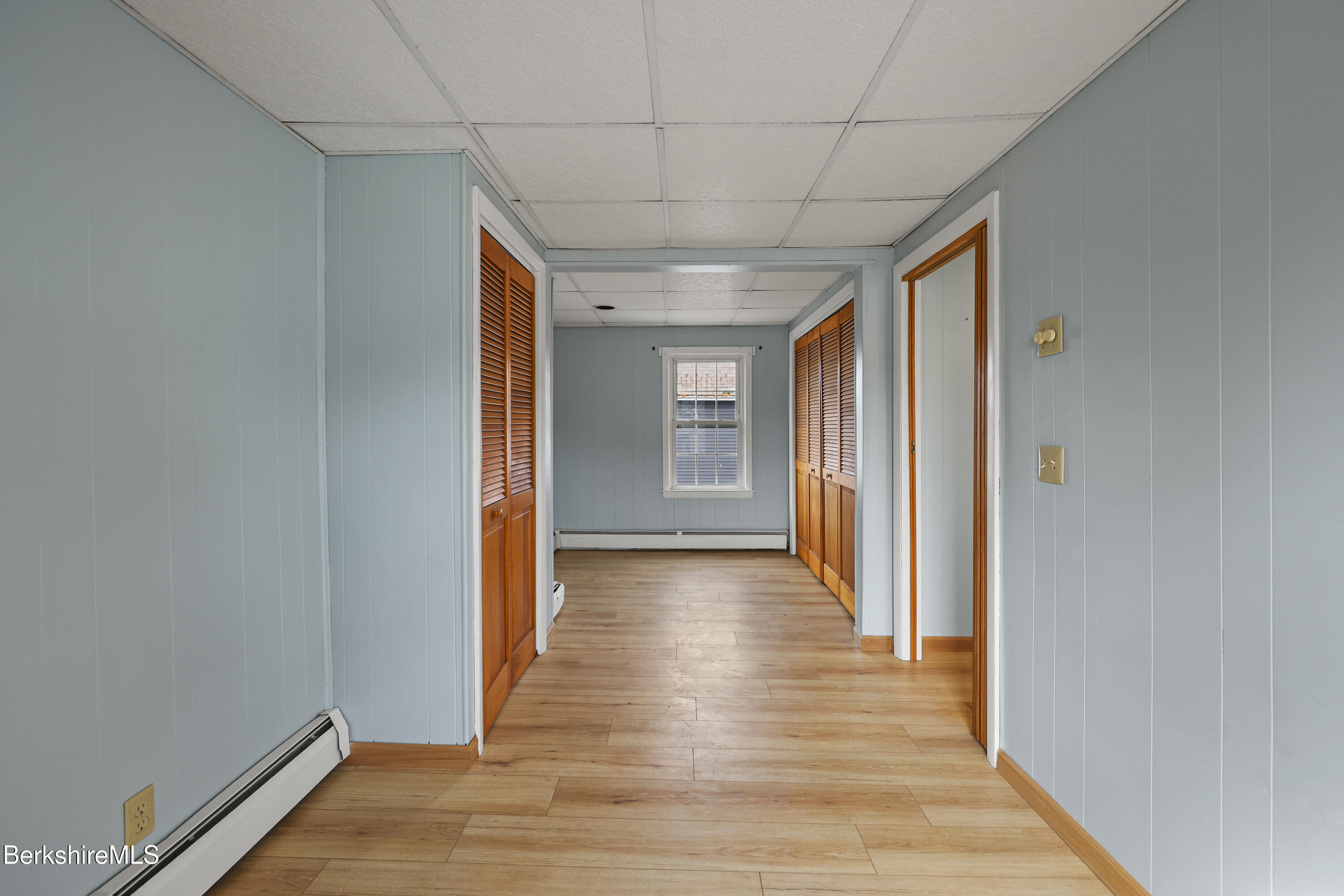 Undisclosed Address Adams, MA 01220 - Photo 19 of 33 a view of a hallway with wooden floor