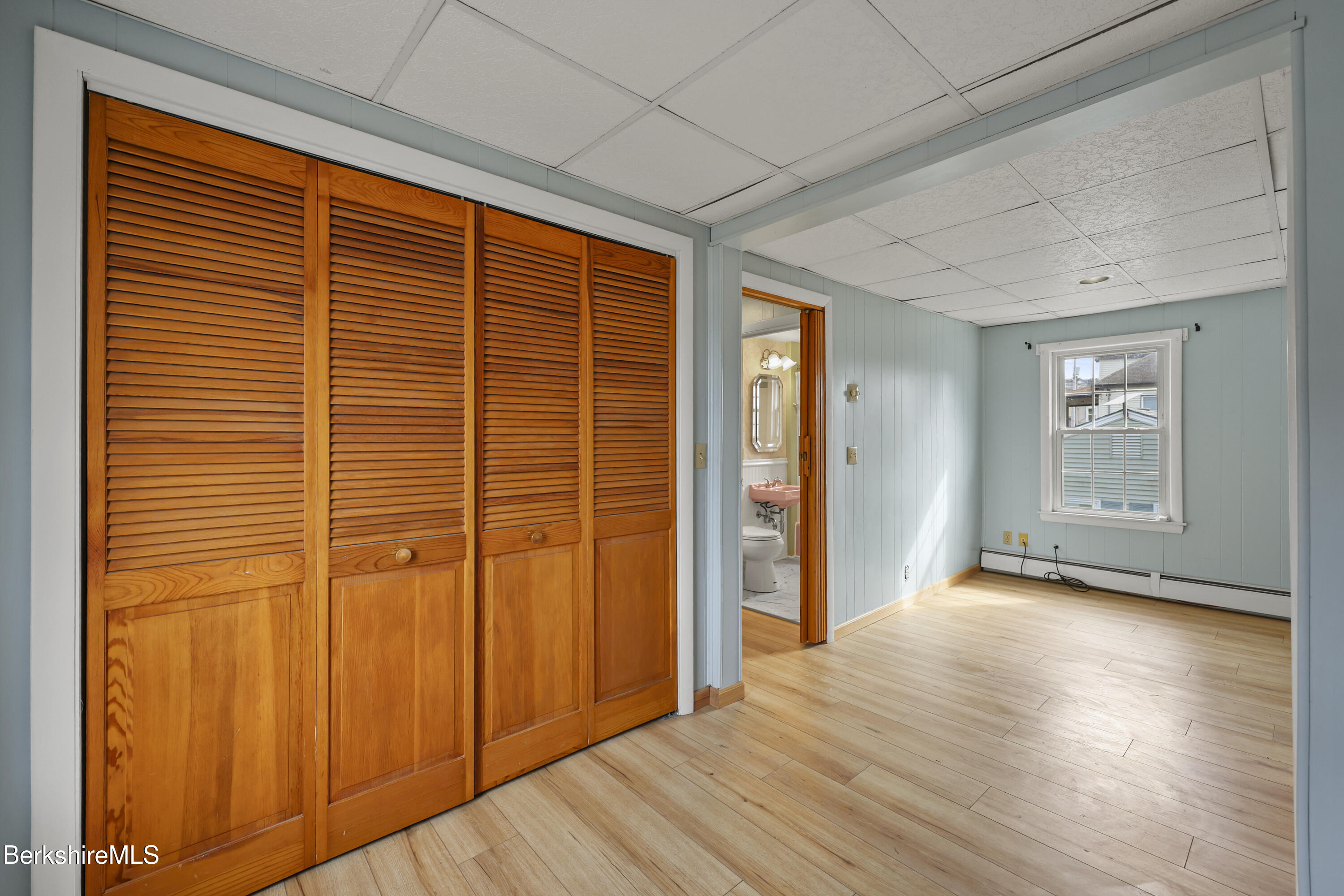 Undisclosed Address Adams, MA 01220 - Photo 20 of 33 an empty room with wooden floor and windows