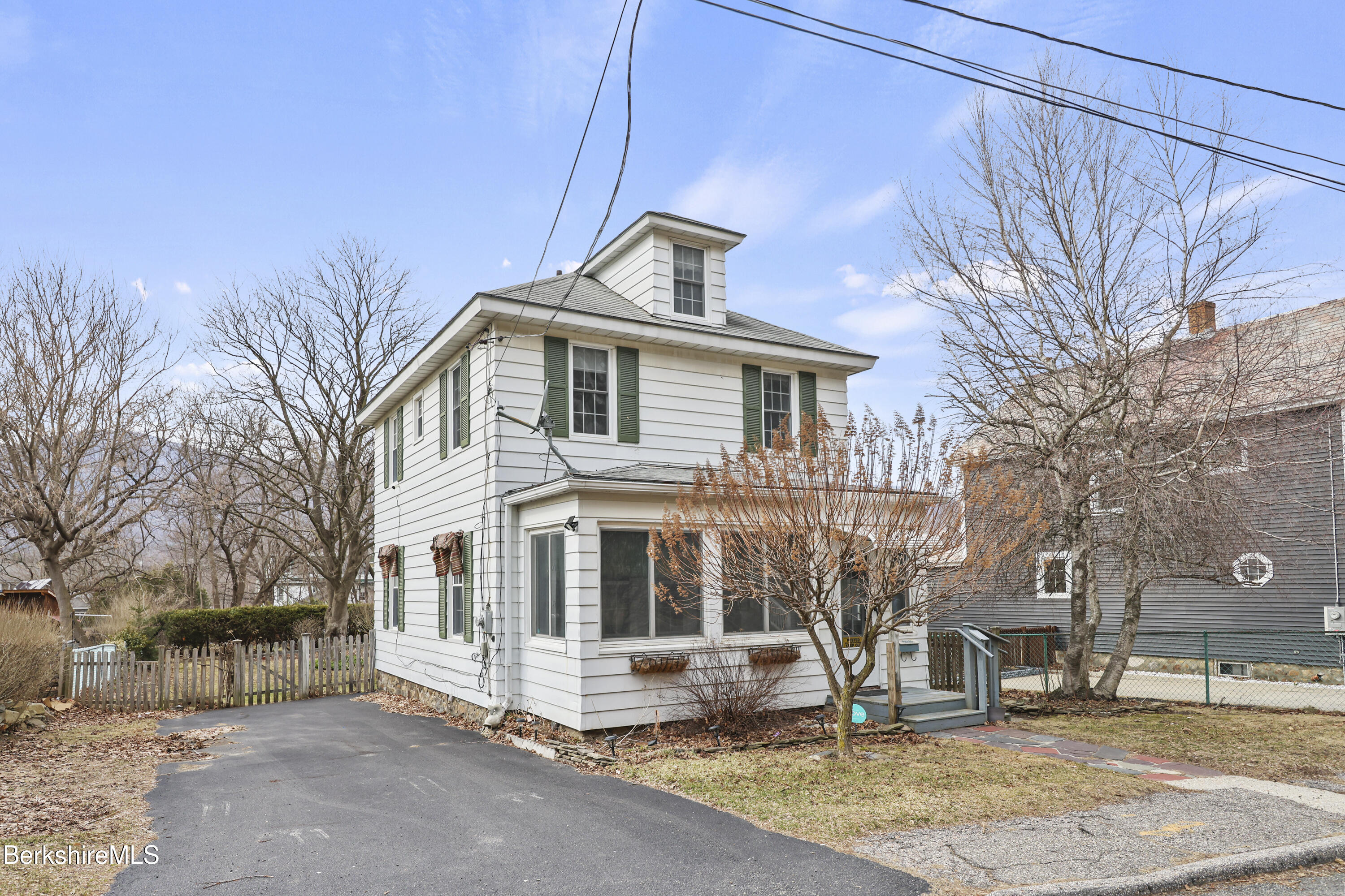 Undisclosed Address Adams, MA 01220 - Photo 2 of 33 a front view of a house with a yard