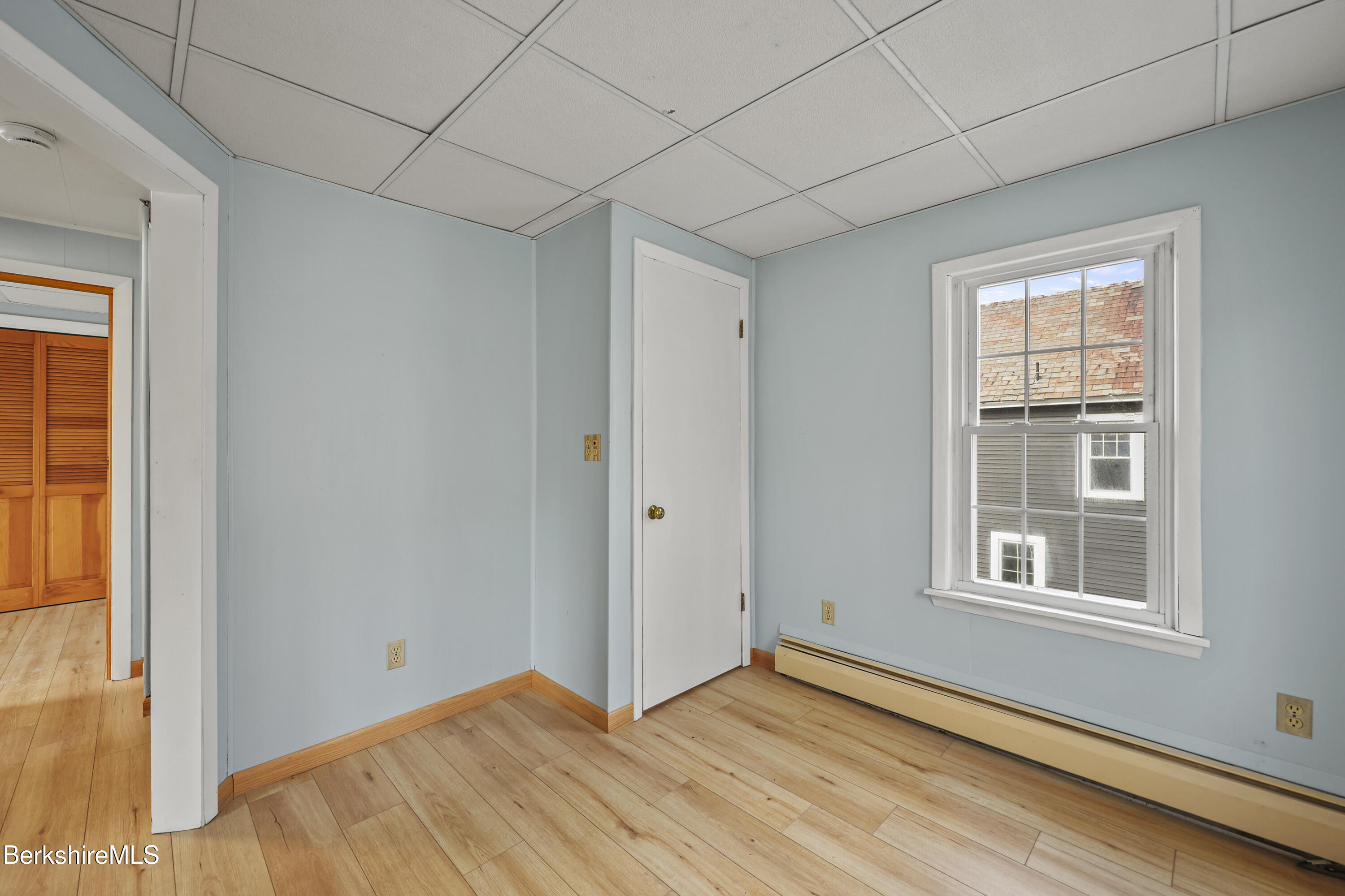 Undisclosed Address Adams, MA 01220 - Photo 24 of 33 a view of an empty room with wooden floor and a window