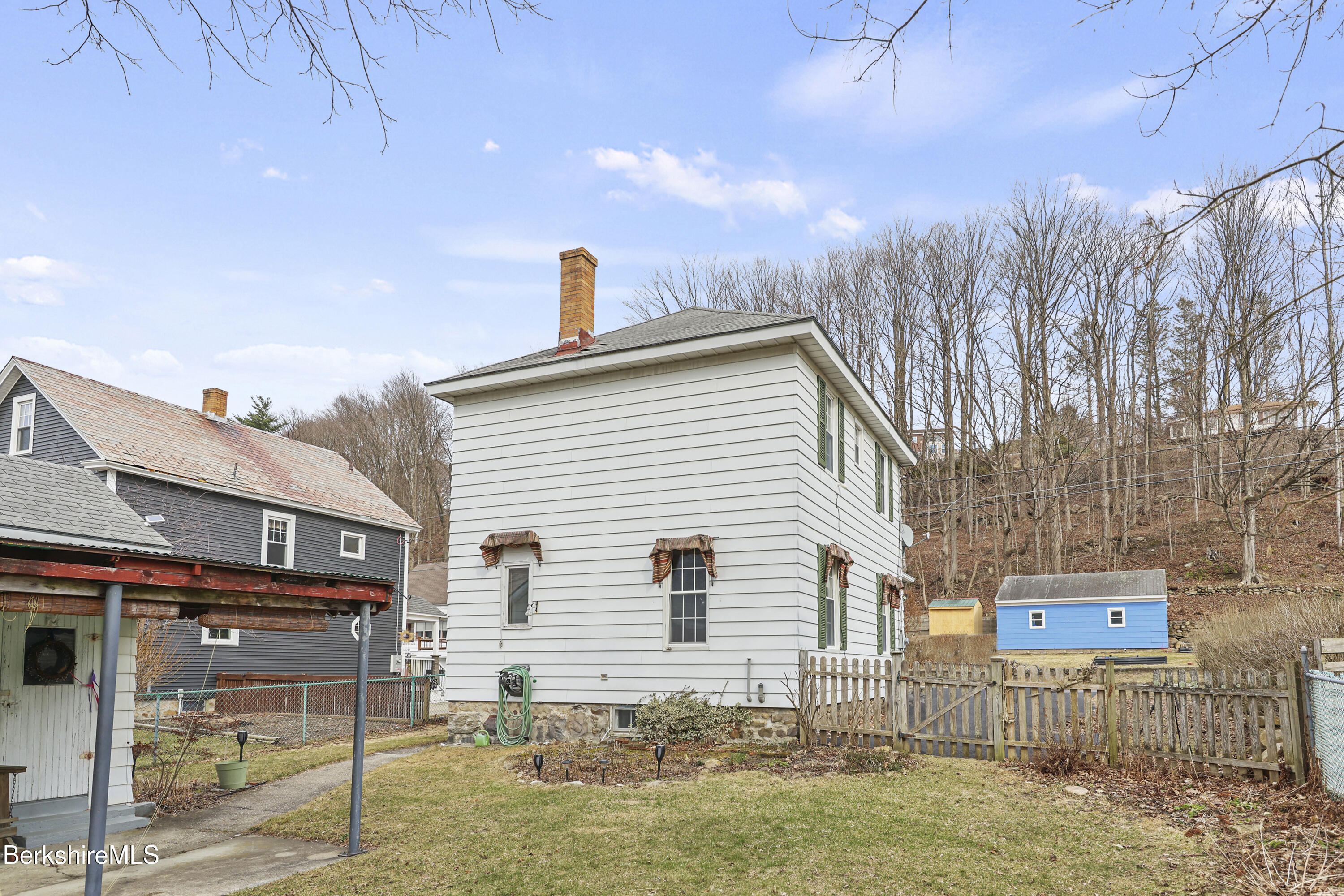 Undisclosed Address Adams, MA 01220 - Photo 27 of 33 a front view of a house with garden