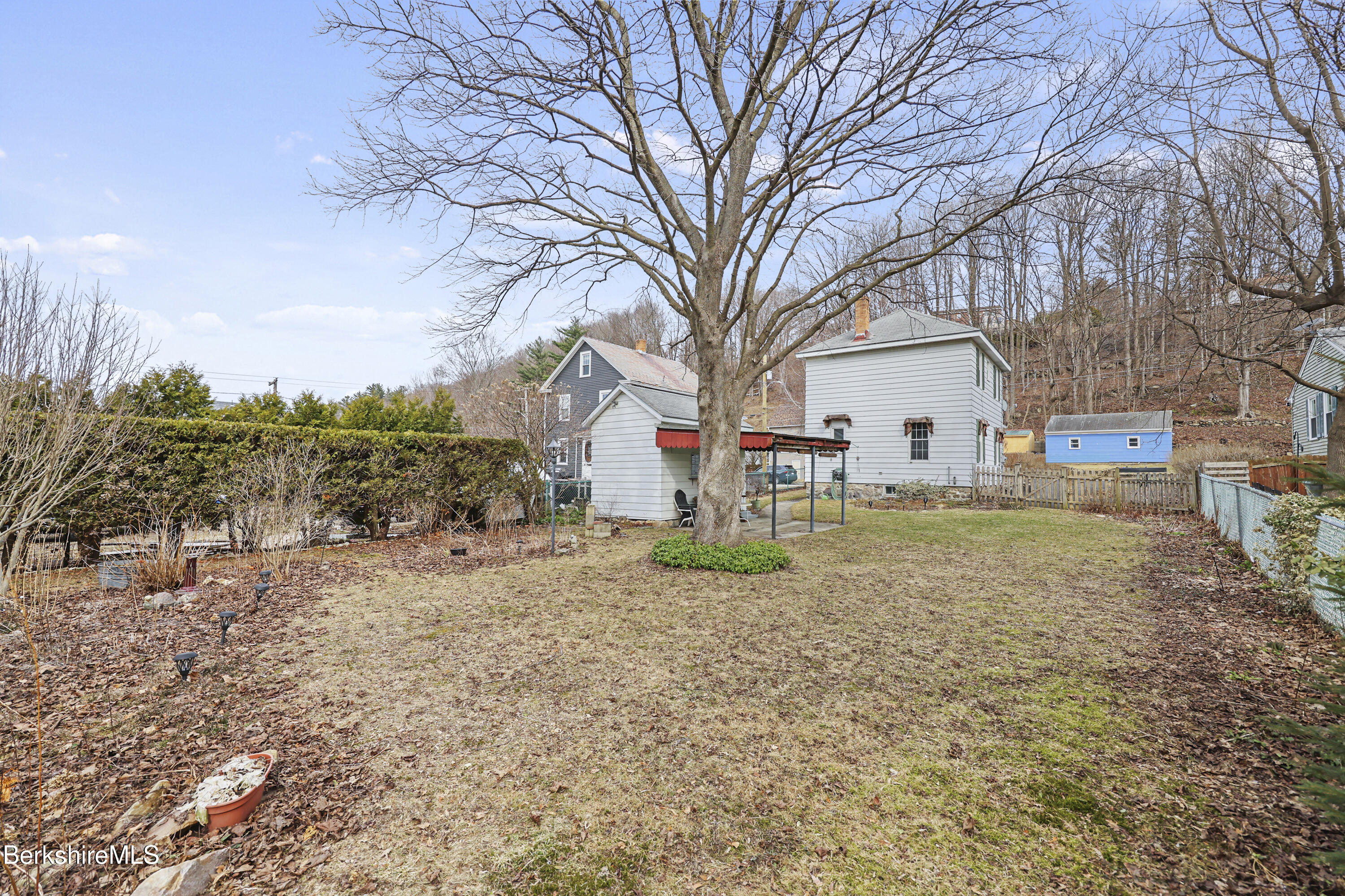 Undisclosed Address Adams, MA 01220 - Photo 28 of 33 a backyard of a house with lots of green space
