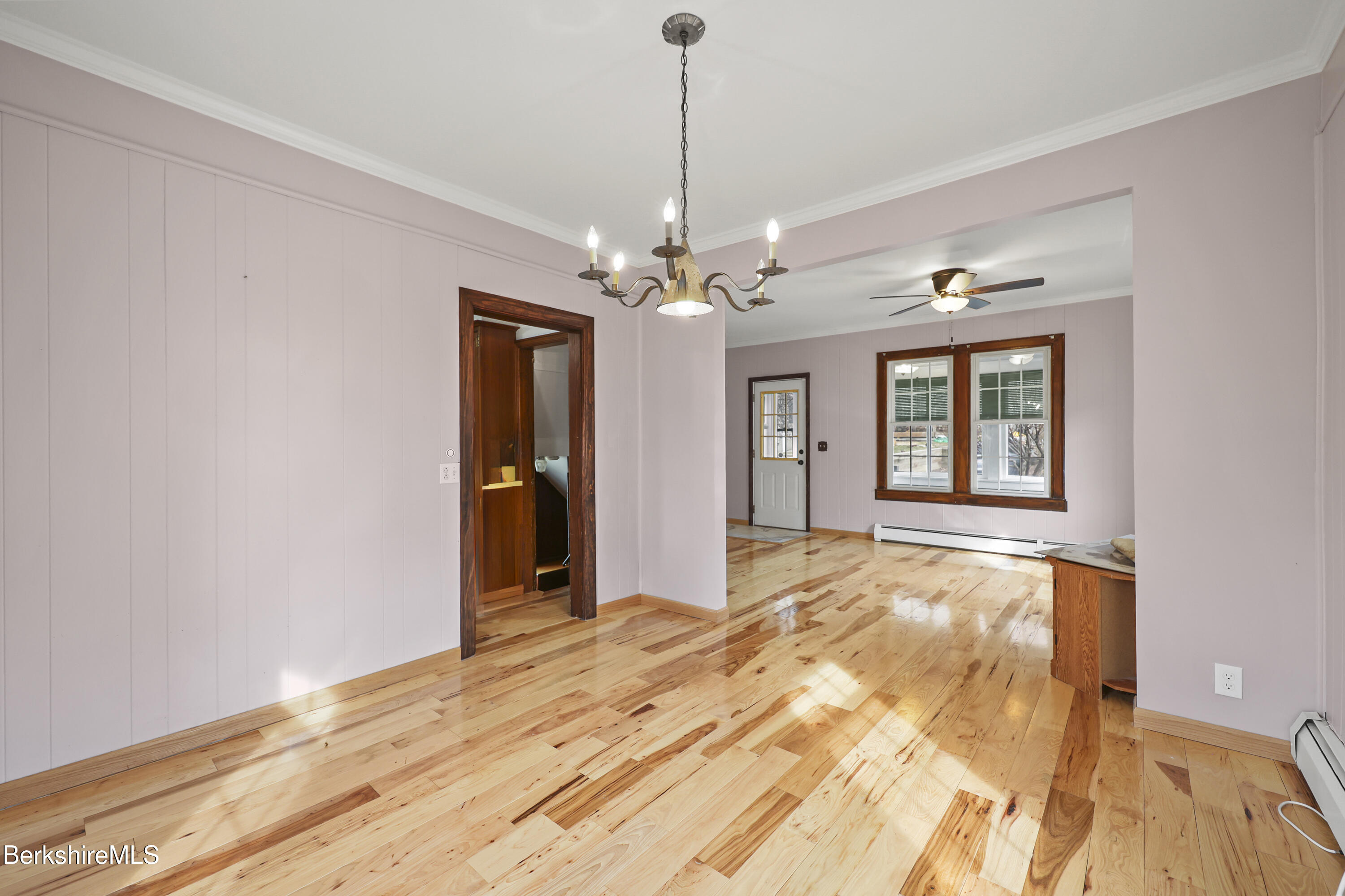 Undisclosed Address Adams, MA 01220 - Photo 10 of 33 a view of a room with wooden floor and chandelier