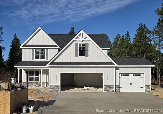 a front view of a house with yard