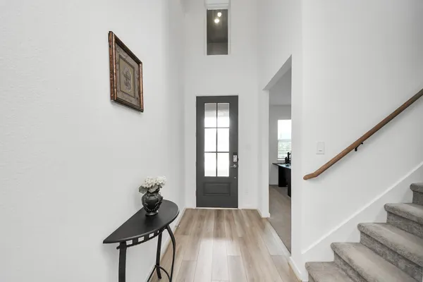 a kitchen with counter top space stainless steel appliances and cabinets