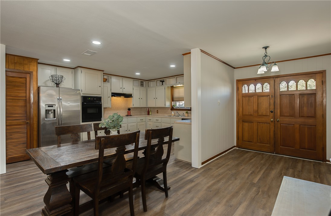 2106 Barak Lane Bryan, TX 77802 - Photo 13 of 27 a kitchen with a table and refrigerator