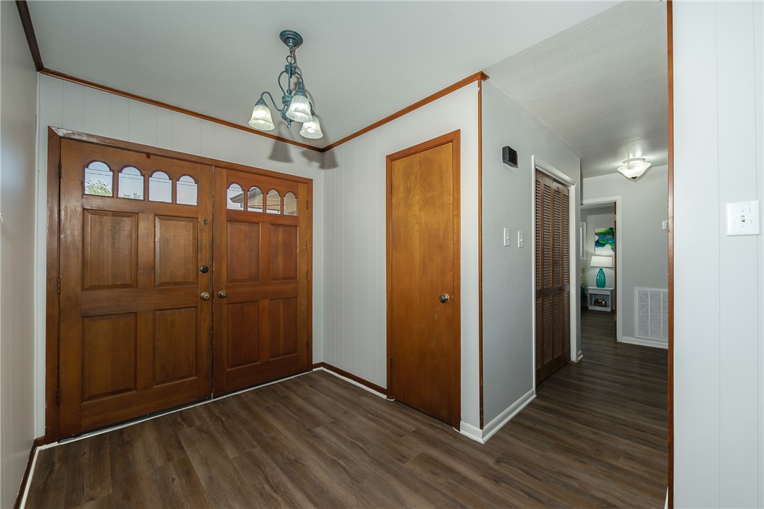2106 Barak Lane Bryan, TX 77802 - Photo 14 of 27 a view of livingroom with hallway and wooden floor