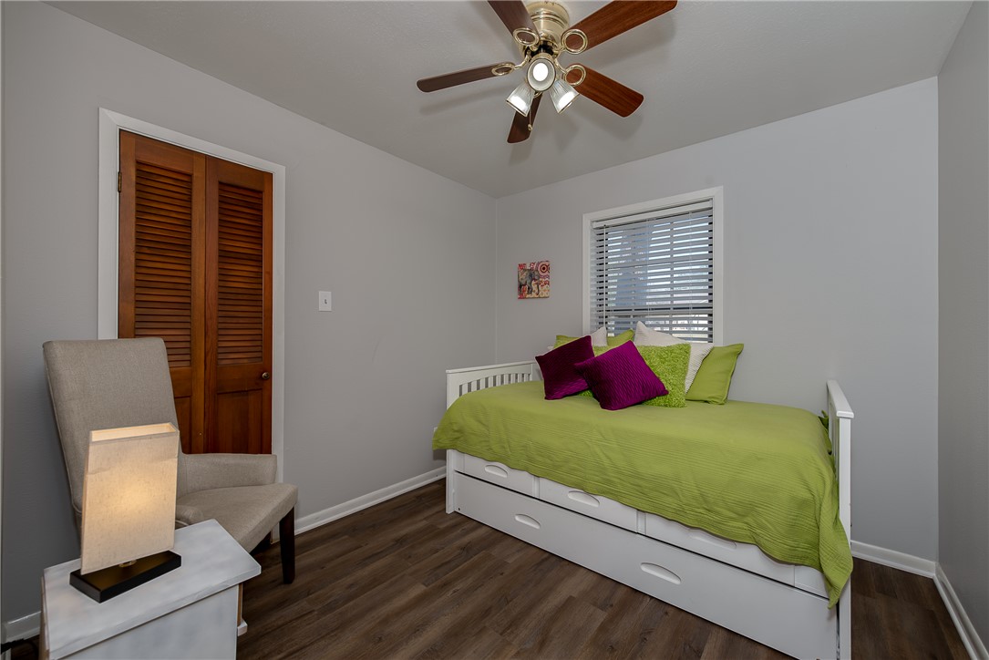 2106 Barak Lane Bryan, TX 77802 - Photo 19 of 27 a bedroom with a bed and a window