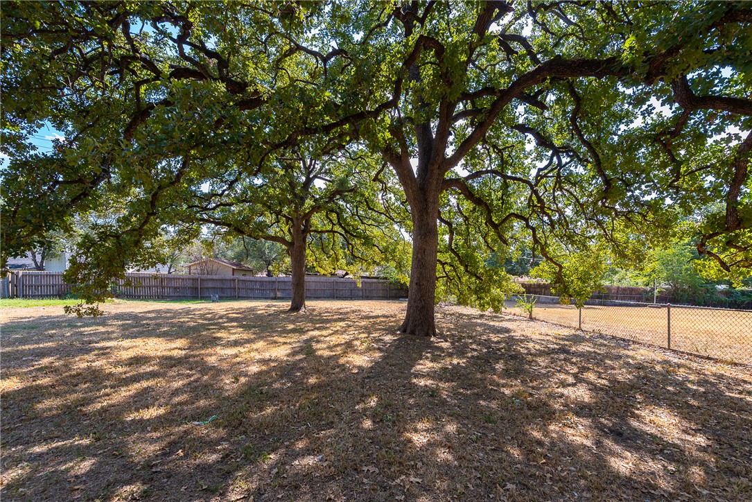 2106 Barak Lane Bryan, TX 77802 - Photo 26 of 27 a view of a yard with trees