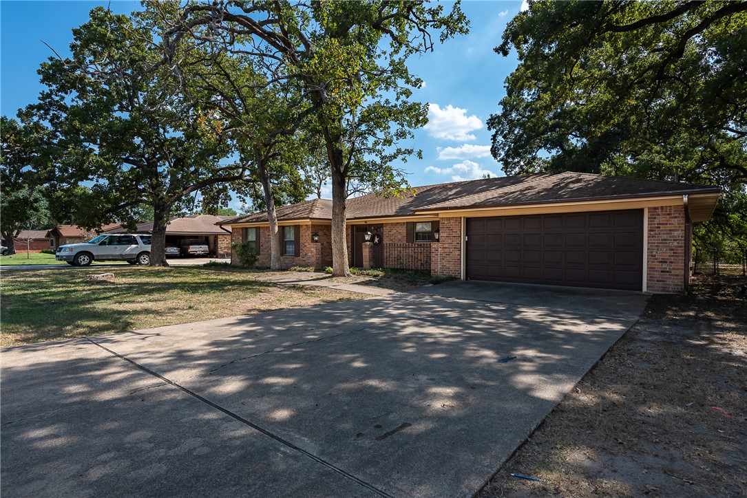 2106 Barak Lane Bryan, TX 77802 - Photo 3 of 27 a view of a house with a yard