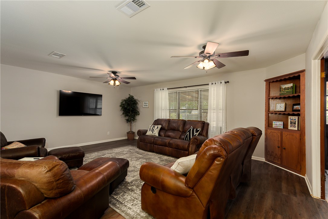 2106 Barak Lane Bryan, TX 77802 - Photo 6 of 27 a living room with furniture a ceiling fan and a window