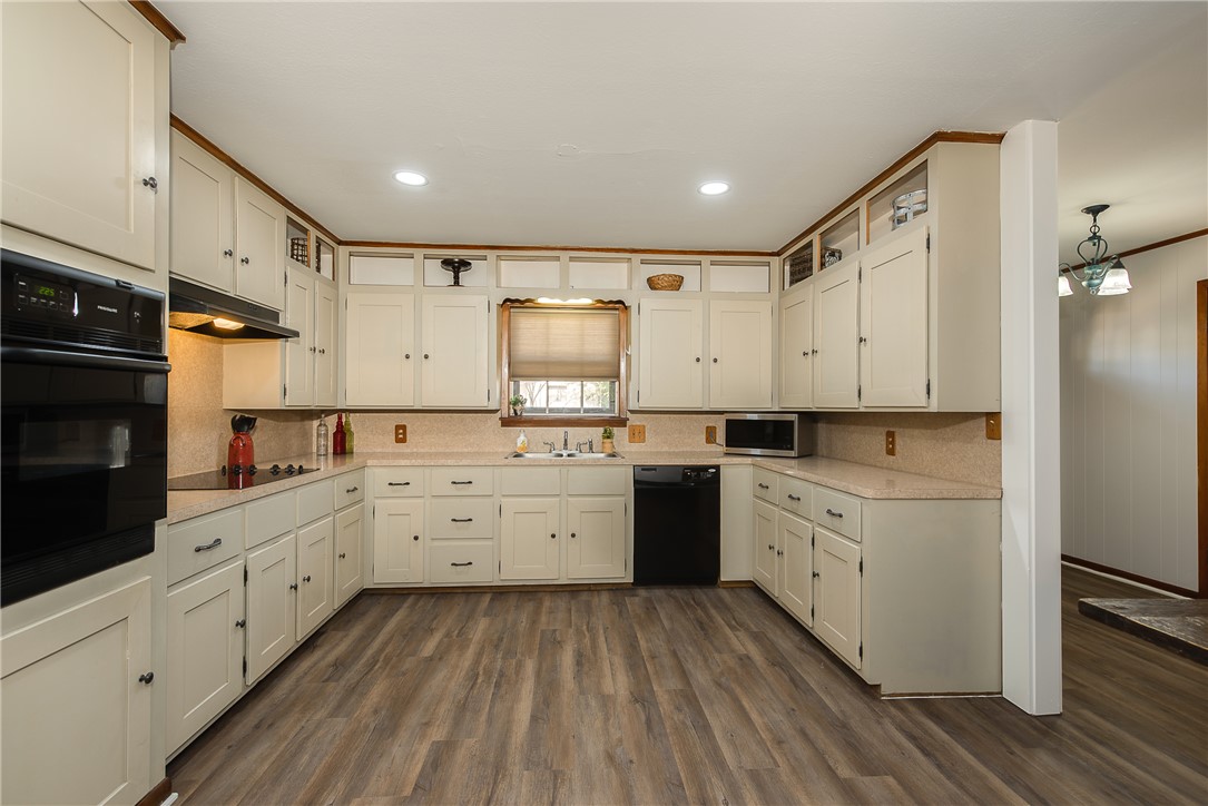 2106 Barak Lane Bryan, TX 77802 - Photo 9 of 27 a kitchen with white cabinets appliances and sink