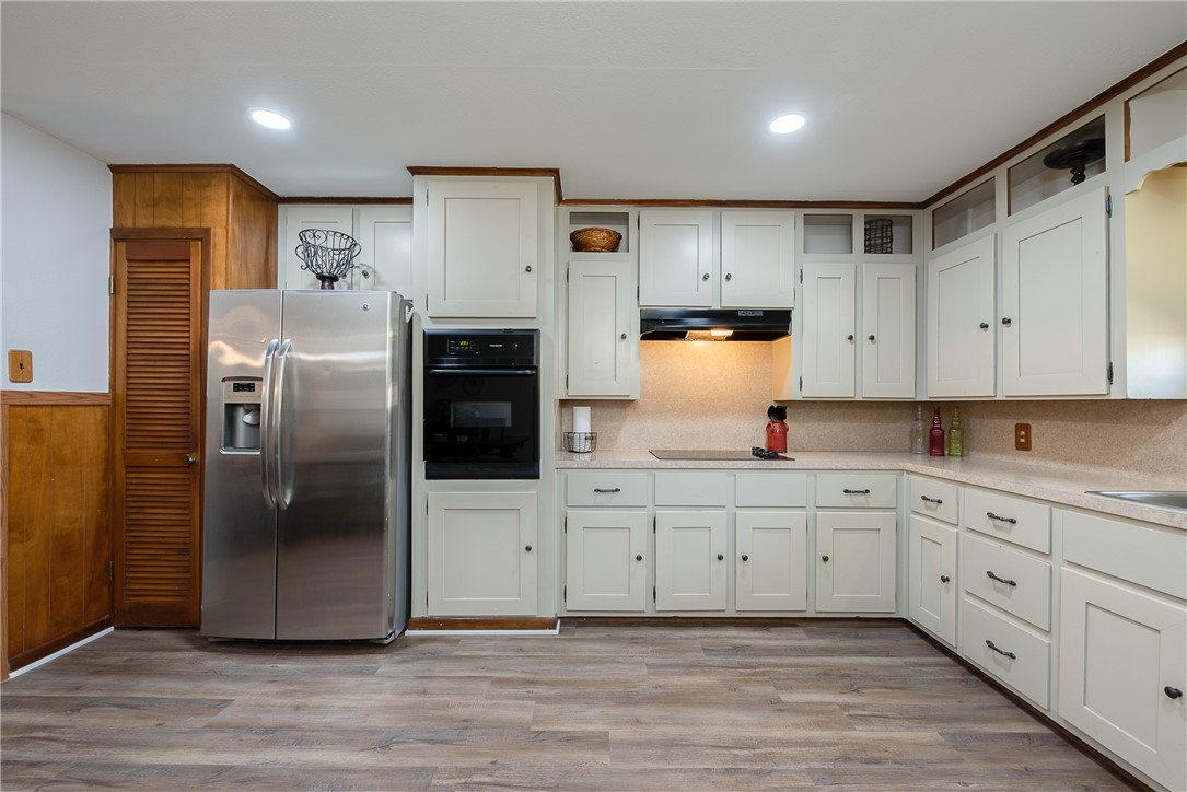2106 Barak Lane Bryan, TX 77802 - Photo 10 of 27 a kitchen with stainless steel appliances a refrigerator sink and cabinets