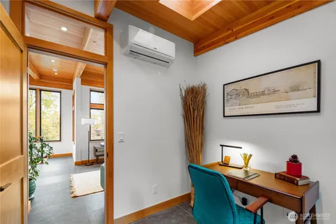 a workspace with furniture and a potted plant
