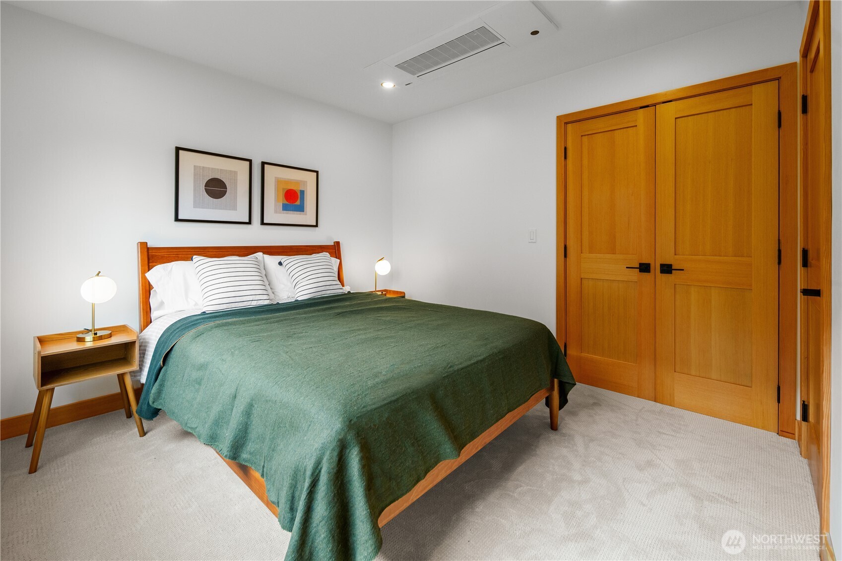 328 Northeast 55th Street Seattle, WA 98105 - Photo 18 of 35 a bedroom with a bed and painting on the wall