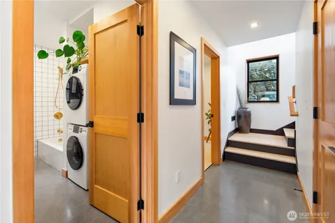 a view of a hallway with washer and dryer