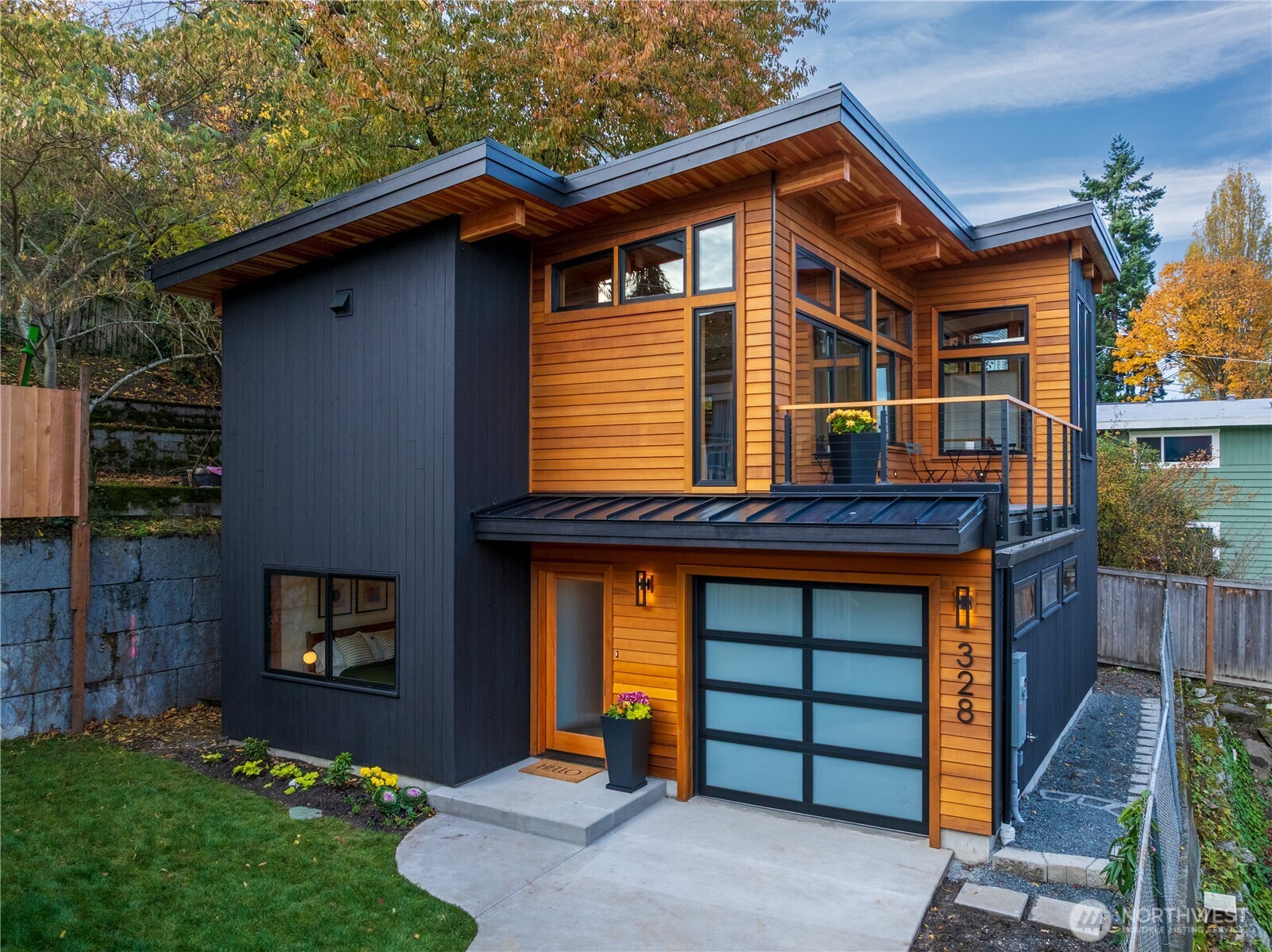 328 Northeast 55th Street Seattle, WA 98105 - Photo 2 of 35 a front view of a house with garden