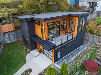 an aerial view of a house with a yard