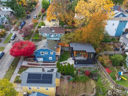 an aerial view of a houses with yard