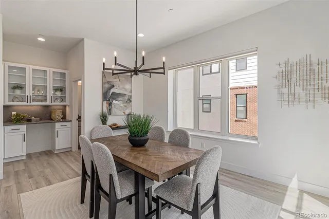 a view of a dining room with furniture window and wooden floor