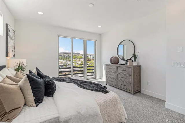 a bedroom with bed and a window