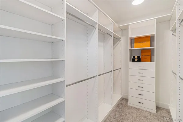 a view of an empty walk in closet