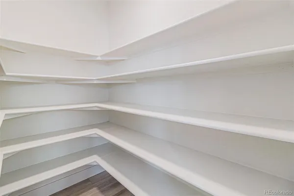 a storage room with wooden floor