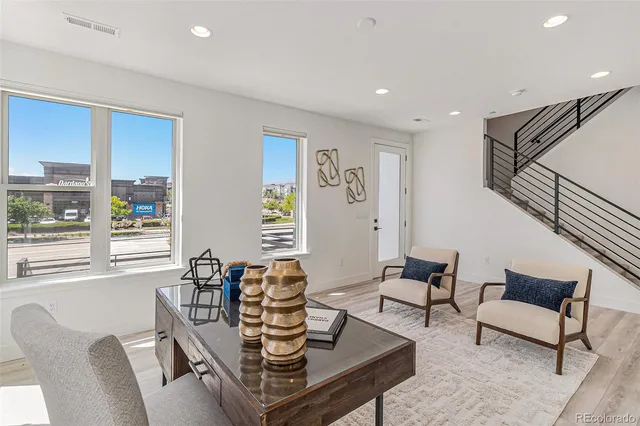 a living room with furniture and a table
