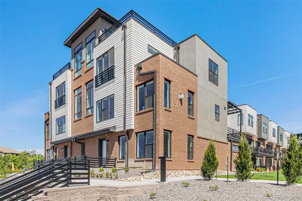 a front view of a residential apartment building with a street
