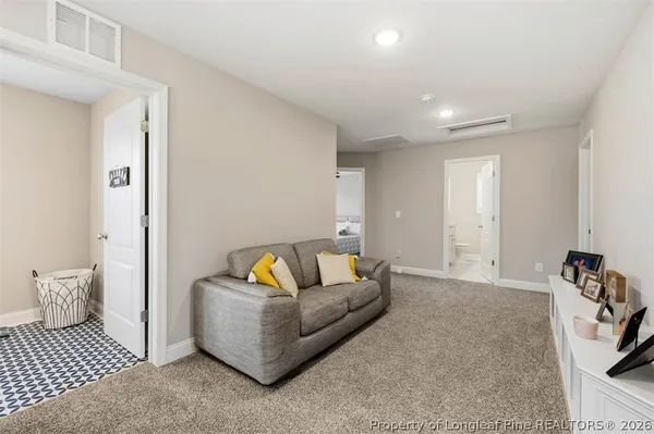 a living room with furniture and a couch