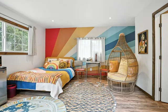 a kitchen with stainless steel appliances a microwave a stove and white cabinets