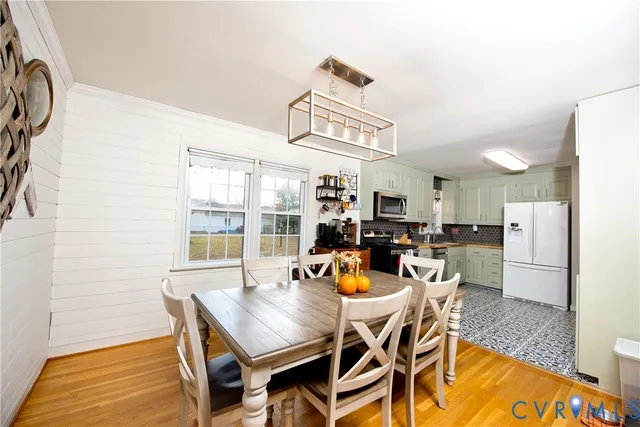 a view of a bedroom with baby crib and book shelf