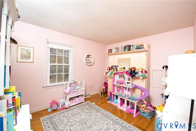 a bathroom with a toilet a sink a vanity and mirror