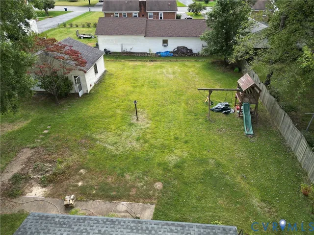 a childrens park with lots of swings and slides