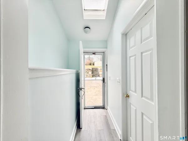 a view of a hallway with a white walls